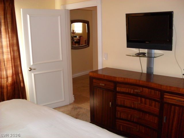270 East Flamingo Road, Unit 436 Las Vegas, NV 89169 - Photo 8 of 19 This cozy bedroom features a stylish dresser, perfect for all your storage needs.