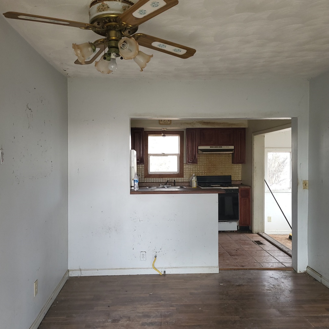 6515 East 5000S Road St. Anne, IL 60964 - Photo 5 of 12 a view of a room with a large window and chandelier