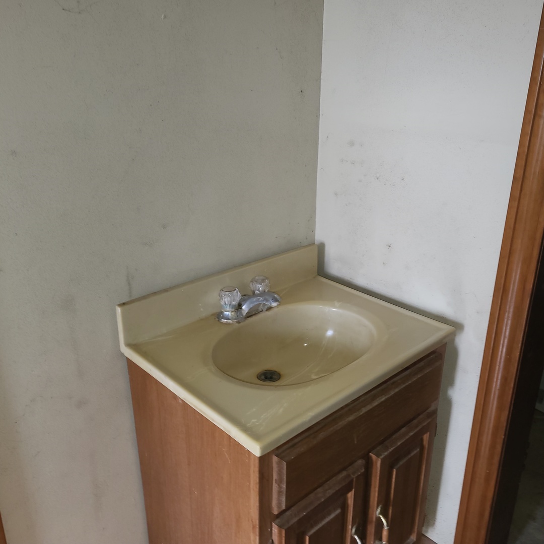 6515 East 5000S Road St. Anne, IL 60964 - Photo 7 of 12 a bathroom with a sink and a vanity
