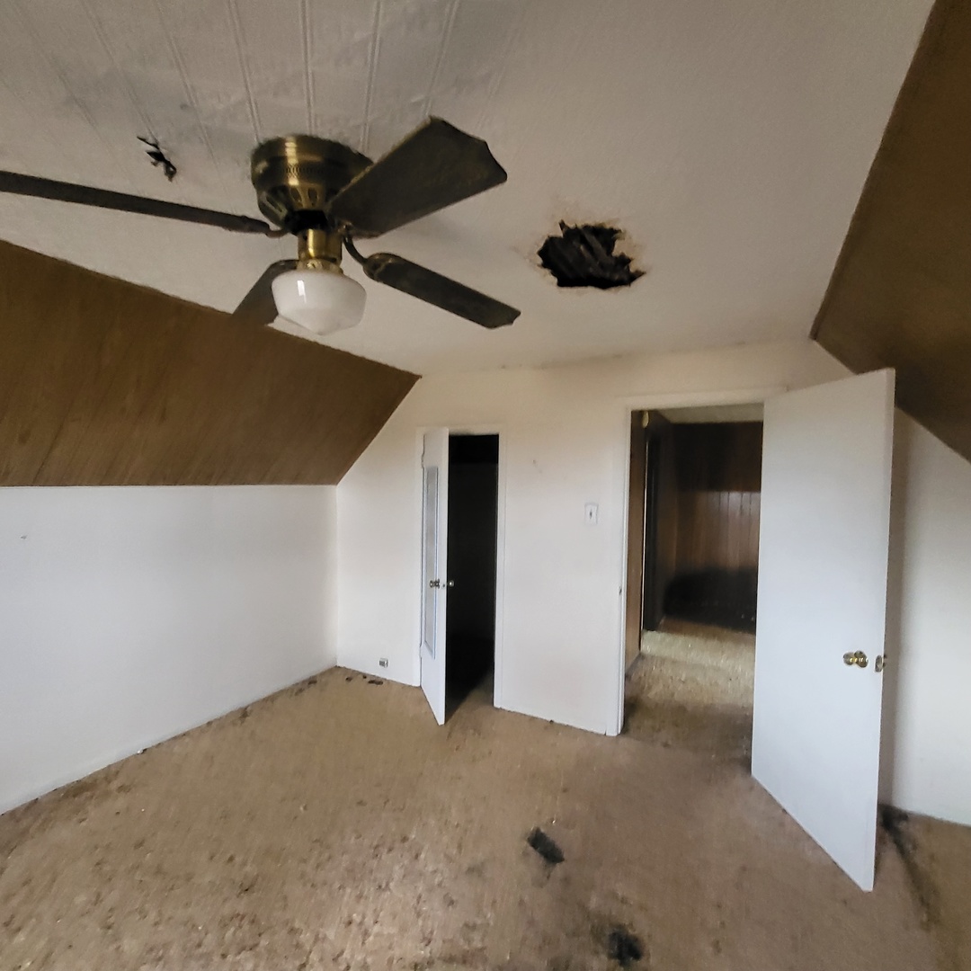 6515 East 5000S Road St. Anne, IL 60964 - Photo 9 of 12 a view of a livingroom with a ceiling fan