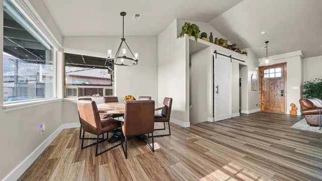 a view of a dining room with furniture window and wooden floor