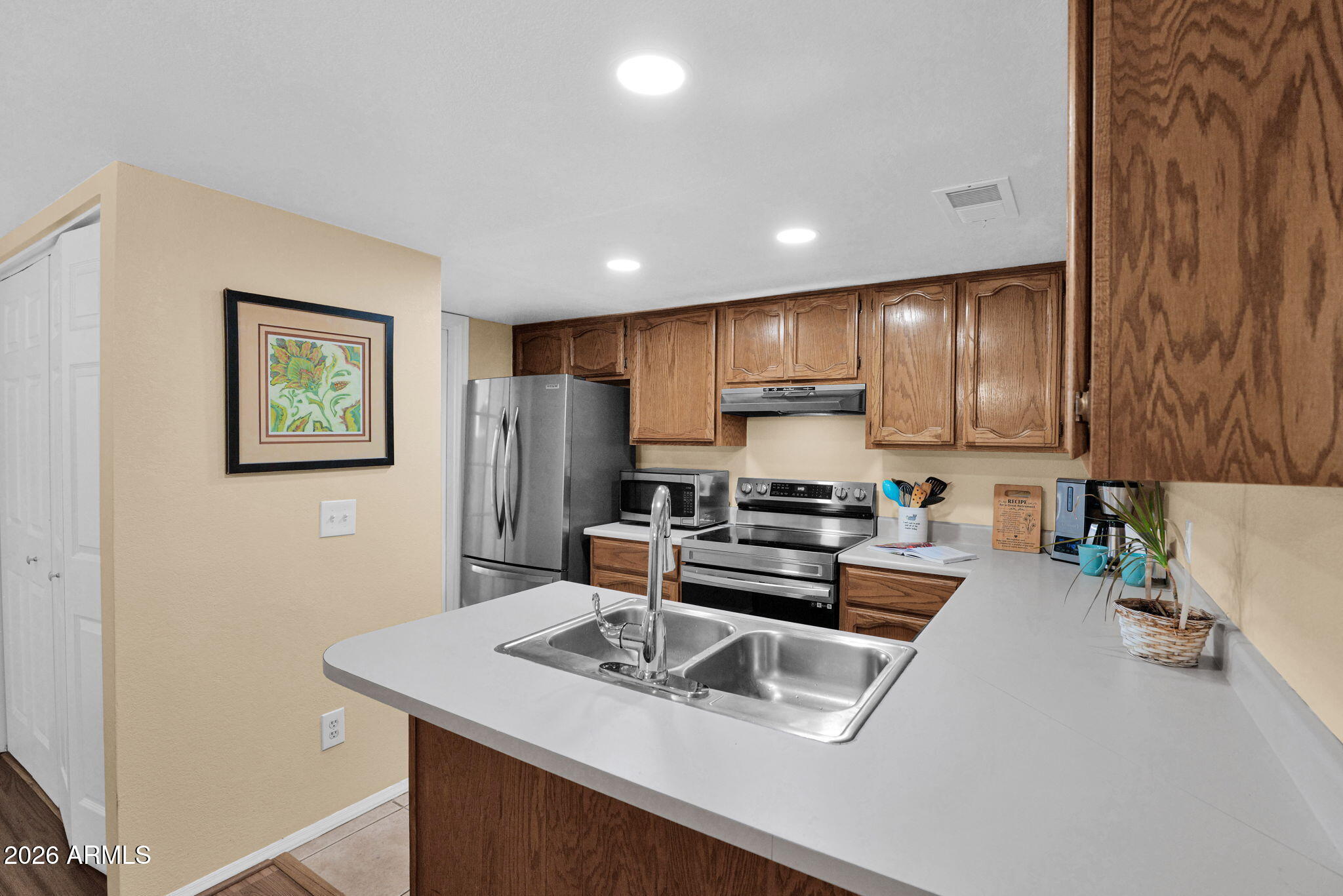 170 East Guadalupe Road, Unit 30 Gilbert, AZ 85234 - Photo 14 of 30 Open kitchen to dining area