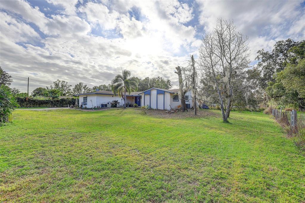 3510 Moores Lake Road Dover, FL 33527 - Photo 5 of 16 a view of a garden with a house