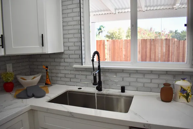 a kitchen with a sink and cabinets