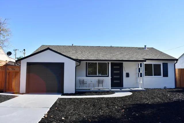a front view of a house with yard