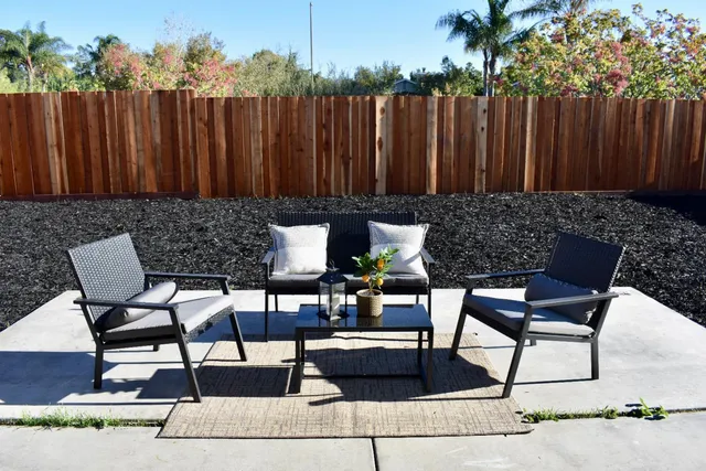 a view of a chairs and table in the patio