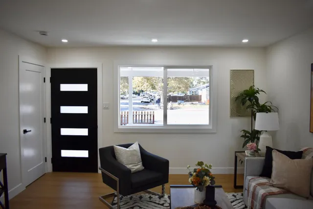 a living room with furniture and a window