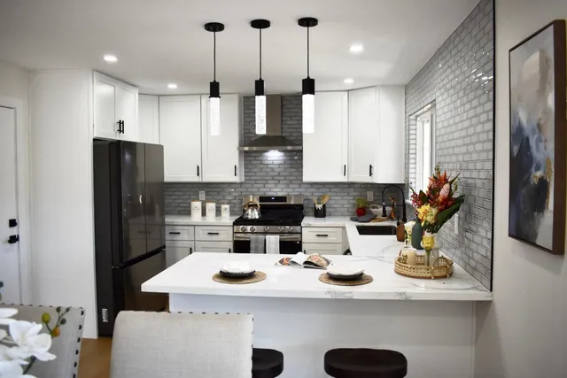 a kitchen with refrigerator and cabinets