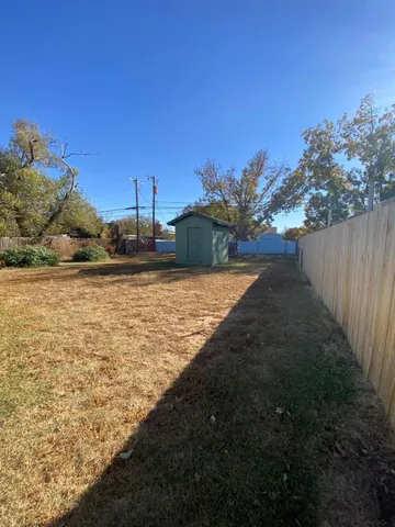 a view of a yard with an ocean view