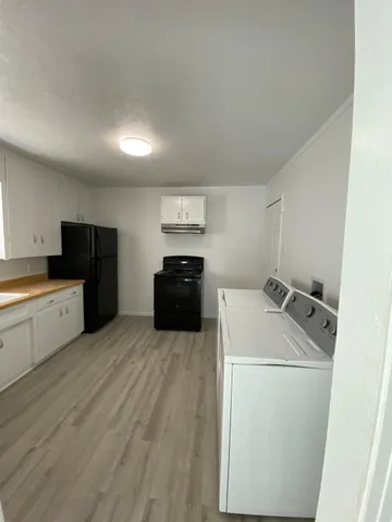 a utility room with washer and dryer
