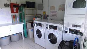 1433 South Belcher Road, Unit F5 Clearwater, FL 33764 - Photo 14 of 18 a utility room with dryer and washer