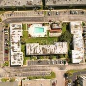 1433 South Belcher Road, Unit F5 Clearwater, FL 33764 - Photo 16 of 18 a front view of a building with outdoor area