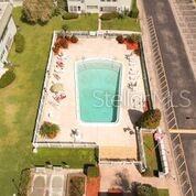 1433 South Belcher Road, Unit F5 Clearwater, FL 33764 - Photo 18 of 18 a picture of a table and chair