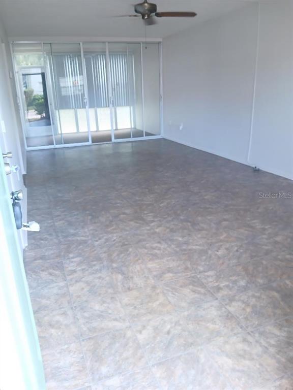1433 South Belcher Road, Unit F5 Clearwater, FL 33764 - Photo 3 of 18 an empty room with windows