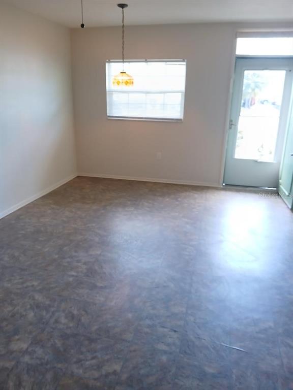 1433 South Belcher Road, Unit F5 Clearwater, FL 33764 - Photo 4 of 18 a view of an empty room with a window