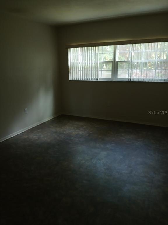 1433 South Belcher Road, Unit F5 Clearwater, FL 33764 - Photo 10 of 18 a view of an empty room and window