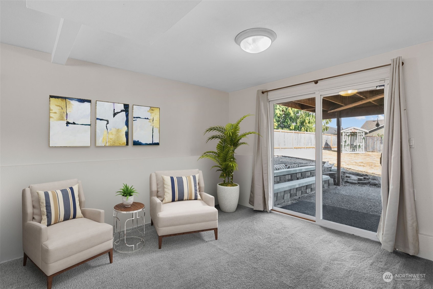 10823 23rd Drive Southeast Everett, WA 98208 - Photo 25 of 39 a living room with furniture and a floor to ceiling window