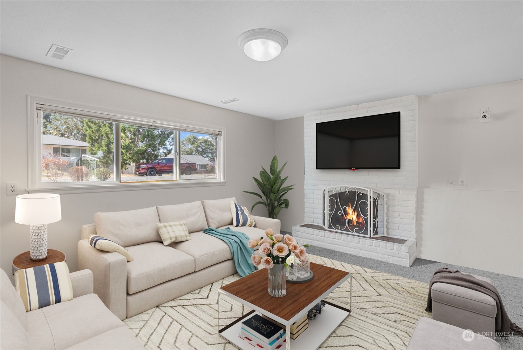 10823 23rd Drive Southeast Everett, WA 98208 - Photo 26 of 39 a living room with furniture flat screen tv and a fireplace