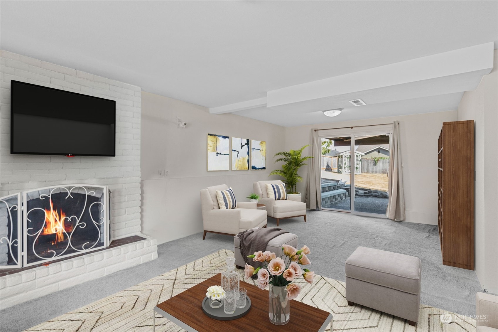 10823 23rd Drive Southeast Everett, WA 98208 - Photo 27 of 39 a living room with furniture a rug and a flat screen tv
