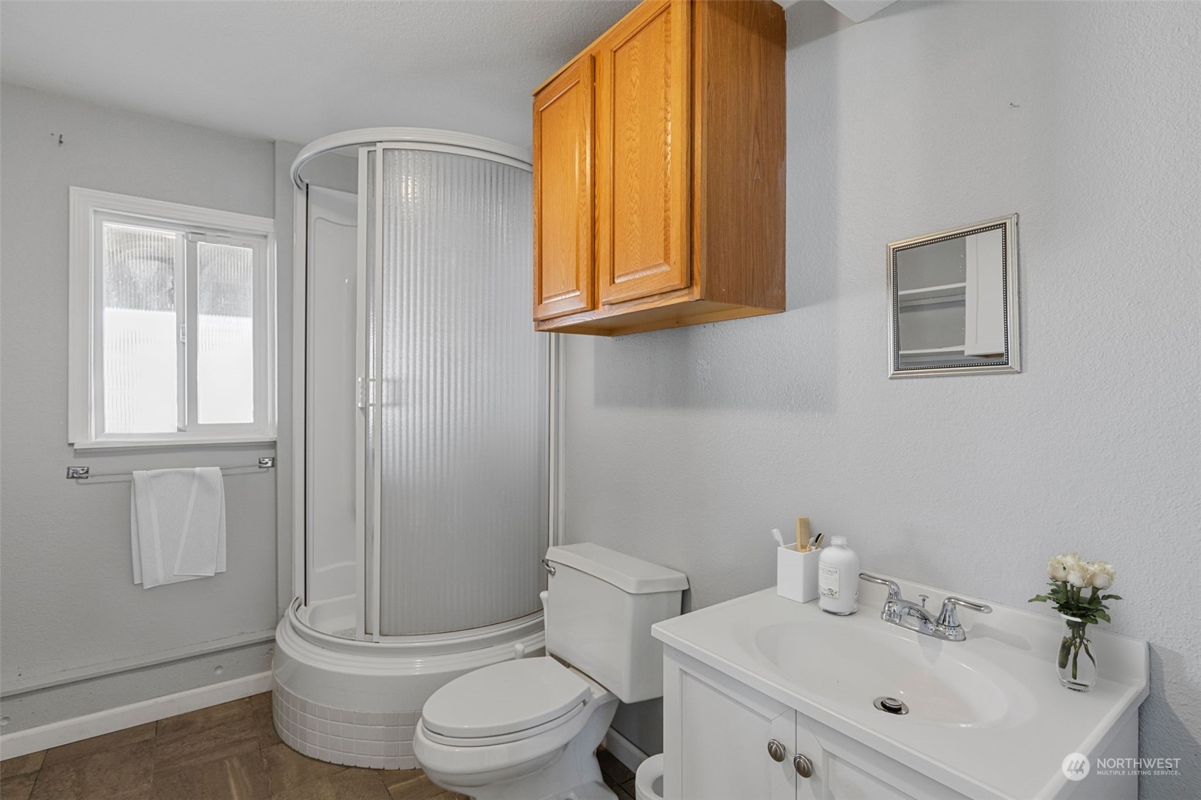 10823 23rd Drive Southeast Everett, WA 98208 - Photo 30 of 39 a bathroom with a sink a toilet and shower