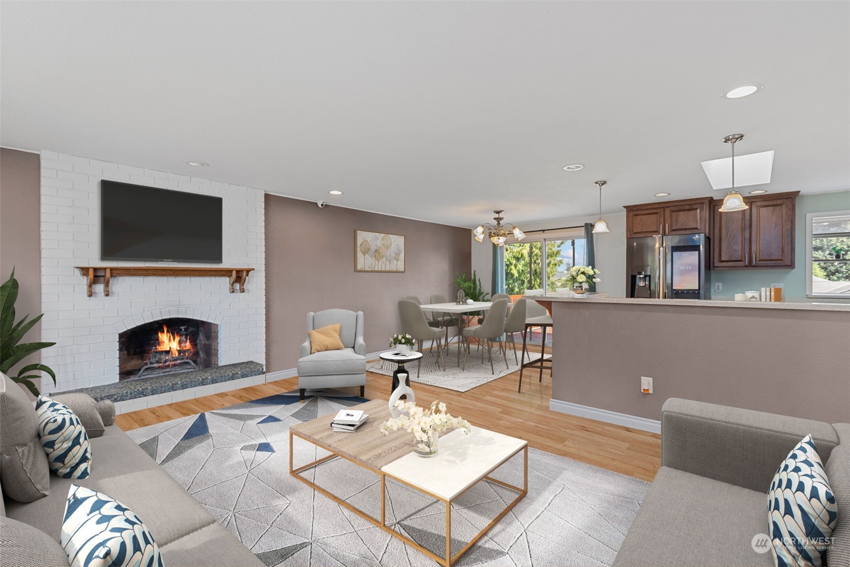 10823 23rd Drive Southeast Everett, WA 98208 - Photo 3 of 39 a living room with furniture a fireplace and a flat screen tv