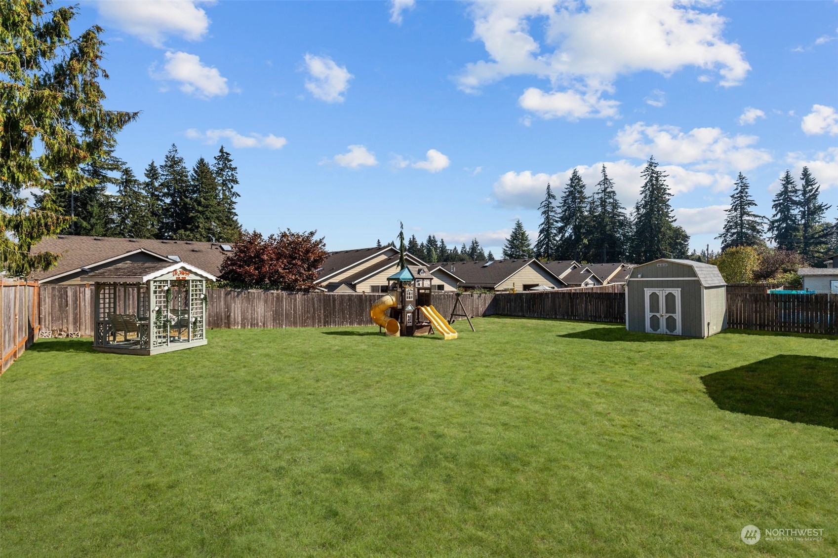 10823 23rd Drive Southeast Everett, WA 98208 - Photo 34 of 39 a front view of a house with a garden and trees