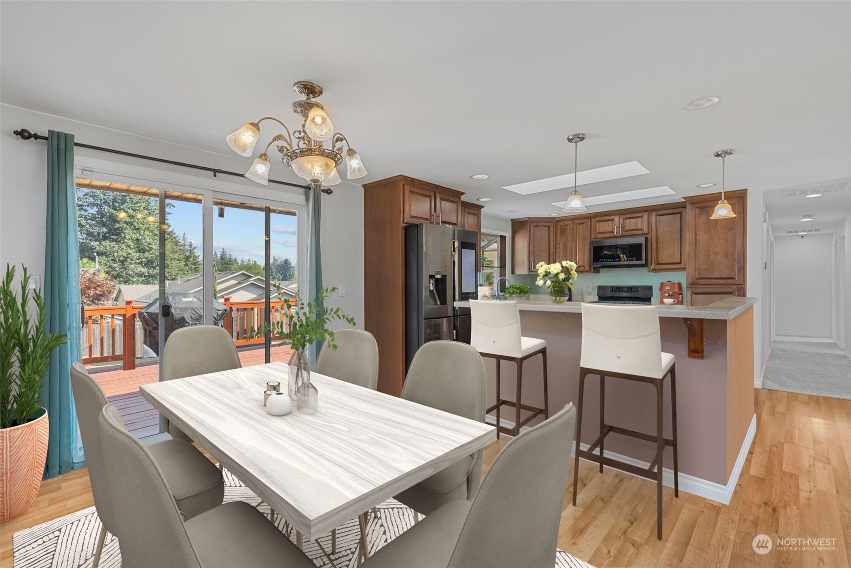 10823 23rd Drive Southeast Everett, WA 98208 - Photo 6 of 39 a view of a dining room with furniture wooden floor and chandelier