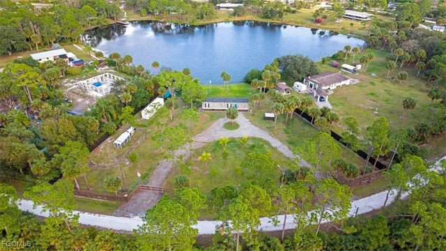 a bedroom with a bed and flat screen tv