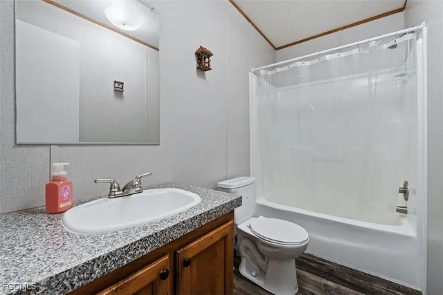 a bedroom with a bed and a table