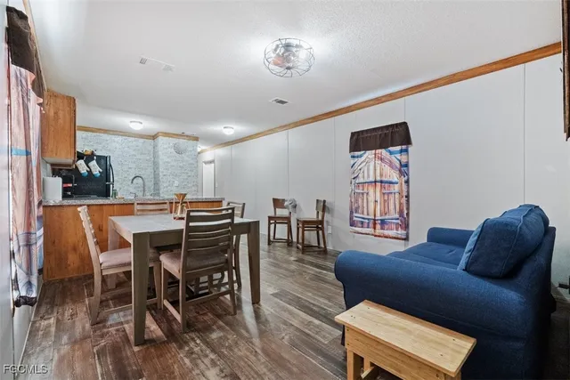 a kitchen with stainless steel appliances granite countertop a refrigerator sink and cabinets