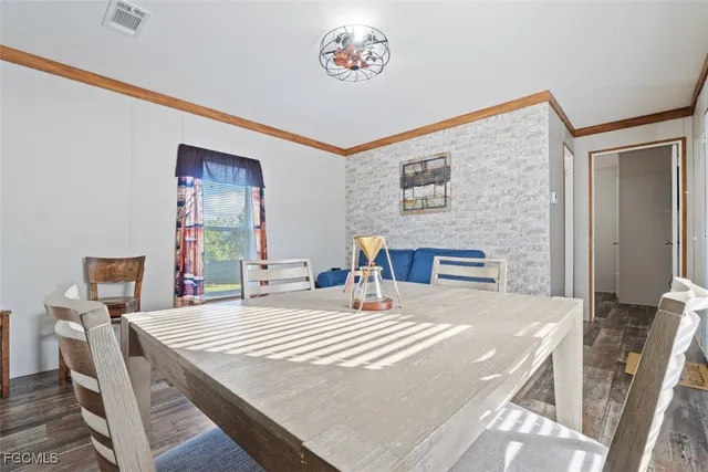 a kitchen with stainless steel appliances kitchen island granite countertop a refrigerator and stove top oven