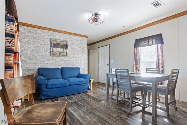 a kitchen with stainless steel appliances granite countertop a refrigerator a stove a sink and a microwave