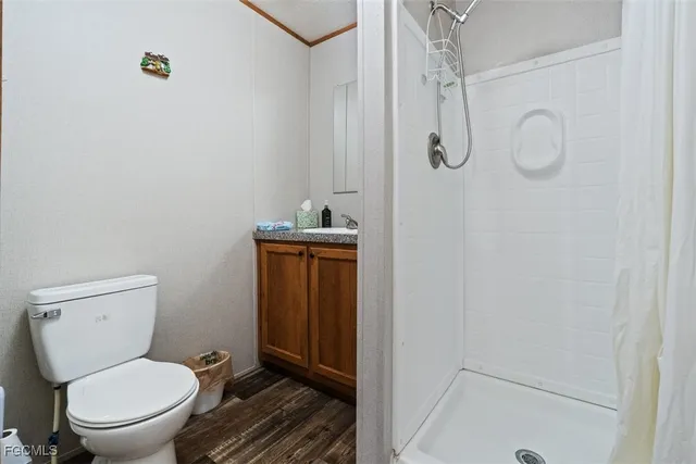 a room with wooden floor and a window