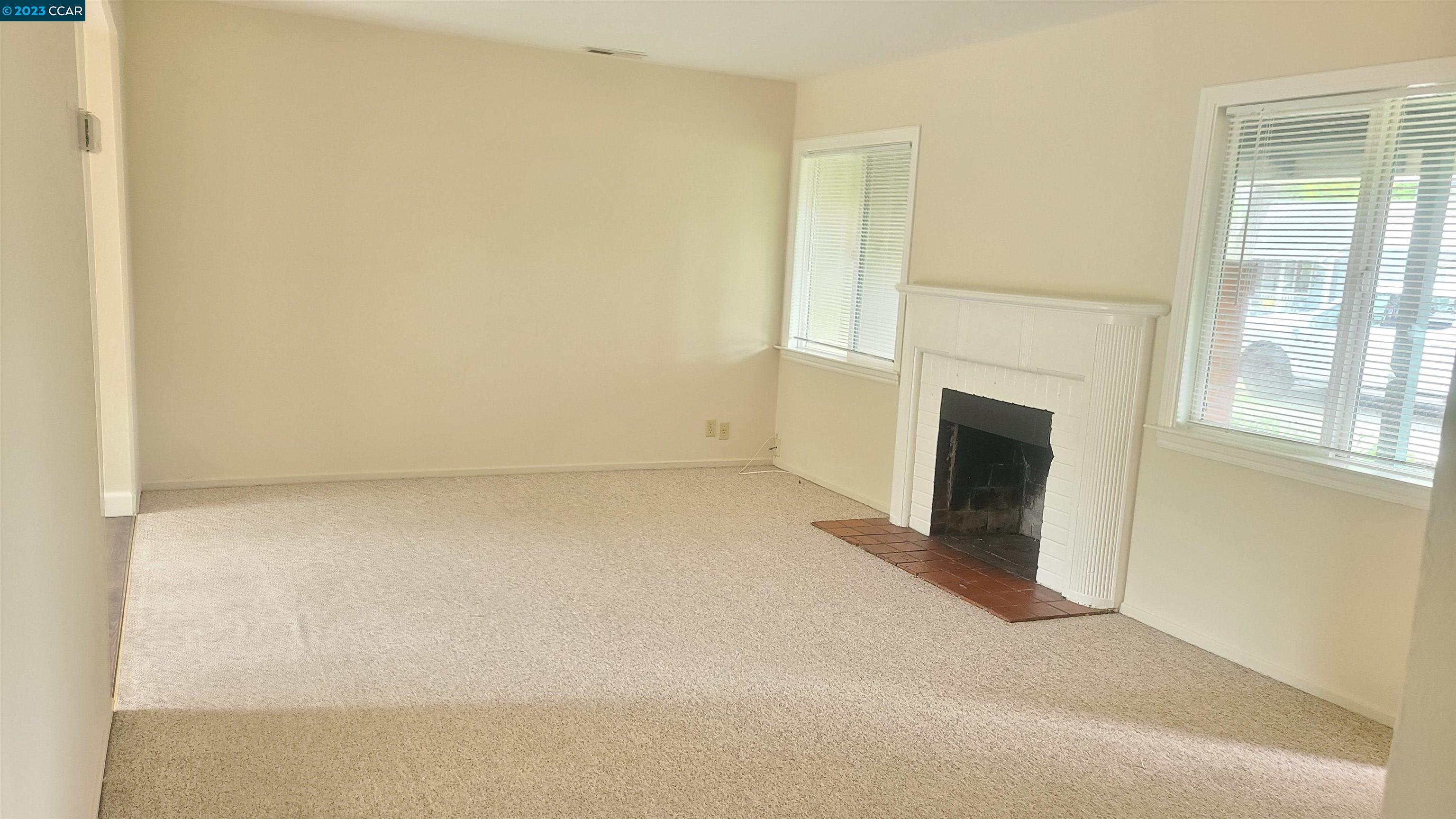 249 Evelyn Drive Pleasant Hill, CA 94523 - Photo 12 of 18 a view of empty room with a fireplace