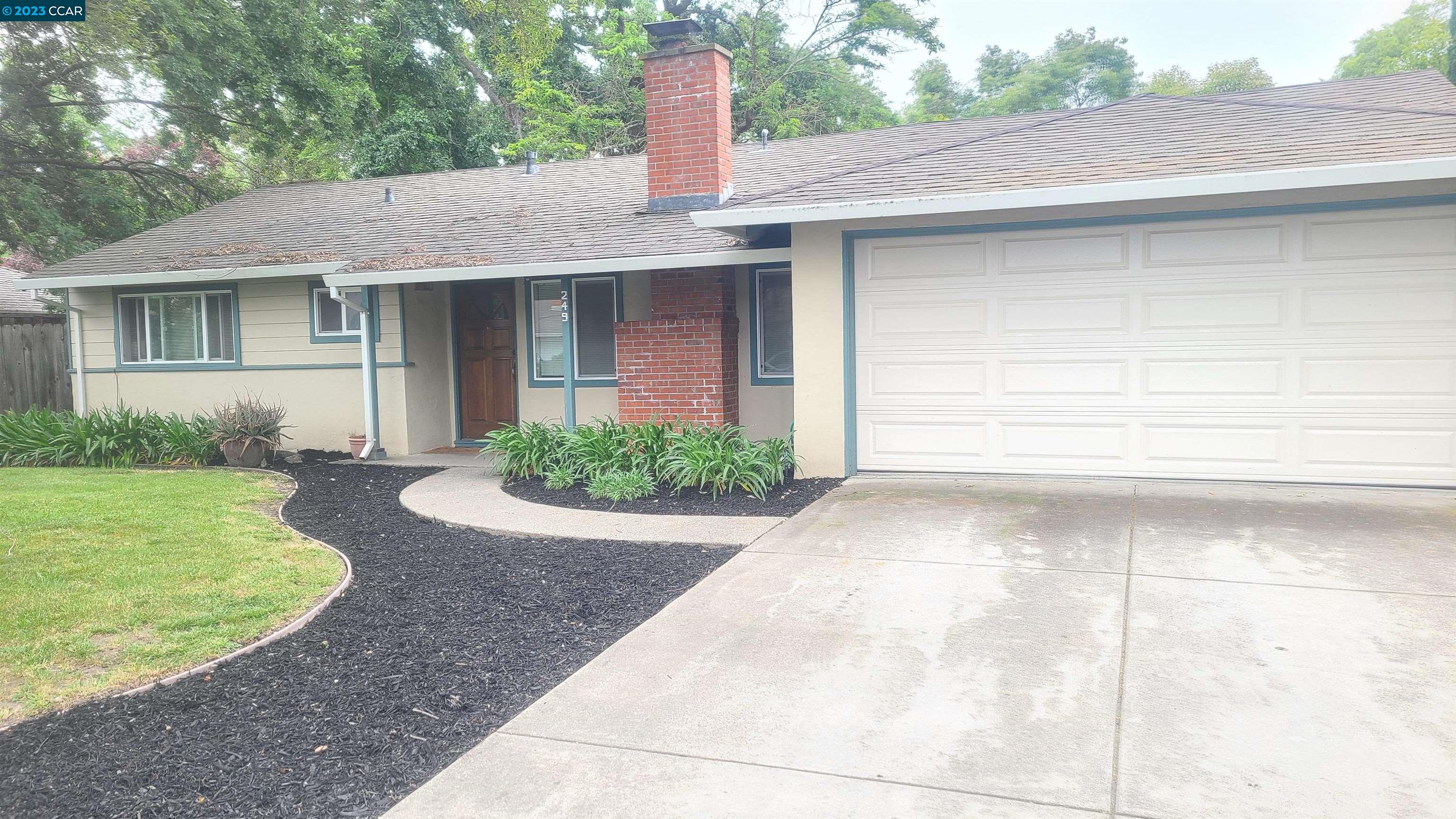 249 Evelyn Drive Pleasant Hill, CA 94523 - Photo 2 of 18 a front view of a house with garden