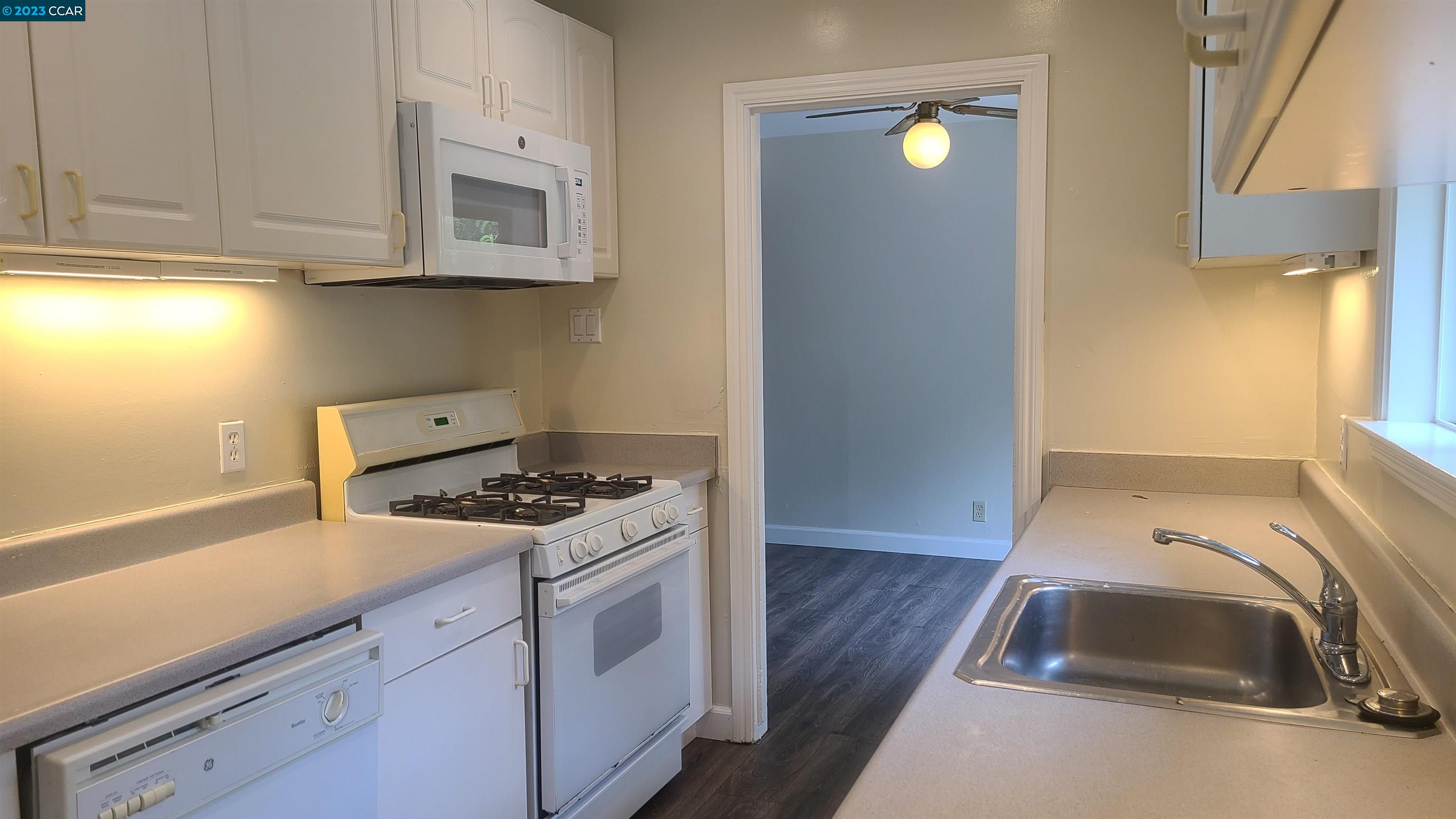 249 Evelyn Drive Pleasant Hill, CA 94523 - Photo 4 of 18 a kitchen with a sink and a stove top oven