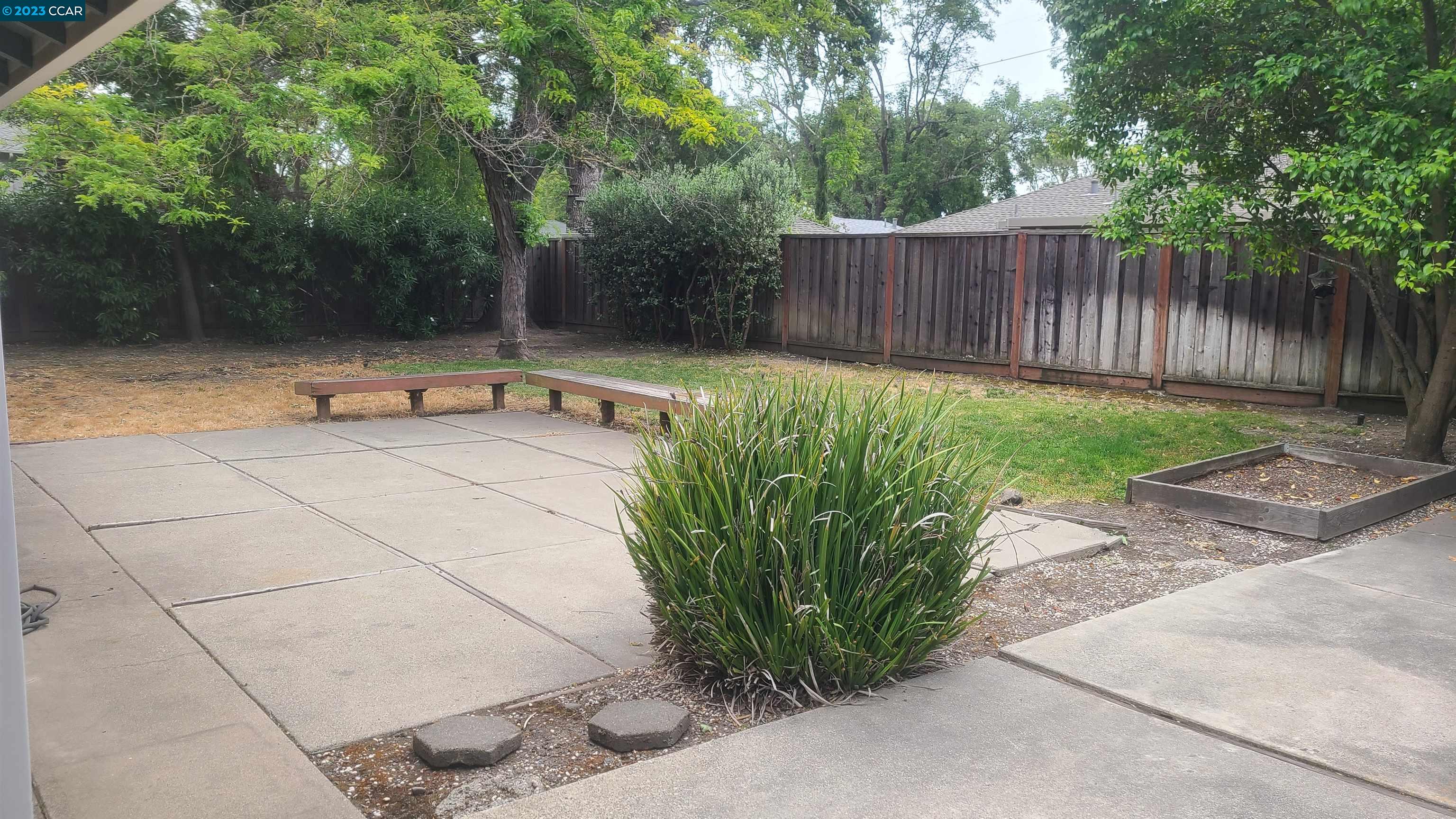 249 Evelyn Drive Pleasant Hill, CA 94523 - Photo 7 of 18 a view of a chairs setting in back yard of the house