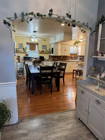 a bathroom with a sink mirror and view