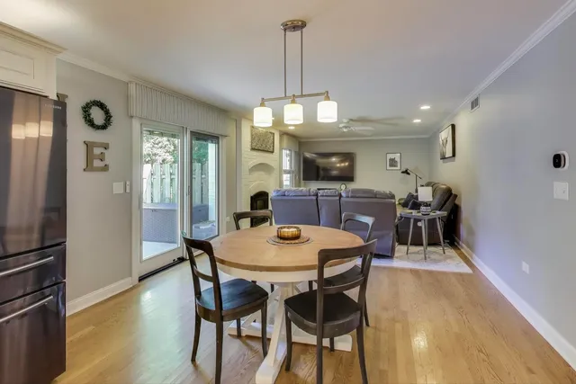 a living room with furniture a fireplace and a table