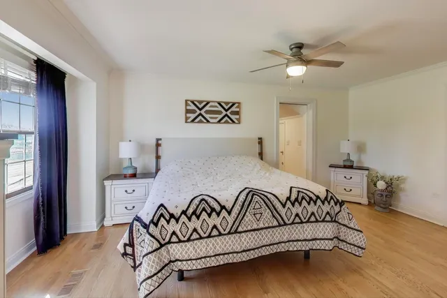 a bathroom with a granite countertop sink a toilet a mirror and shower