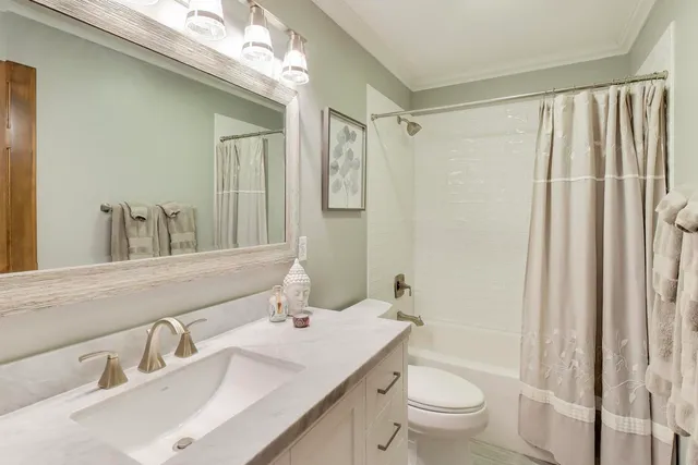 a dinning room with furniture and wooden floor