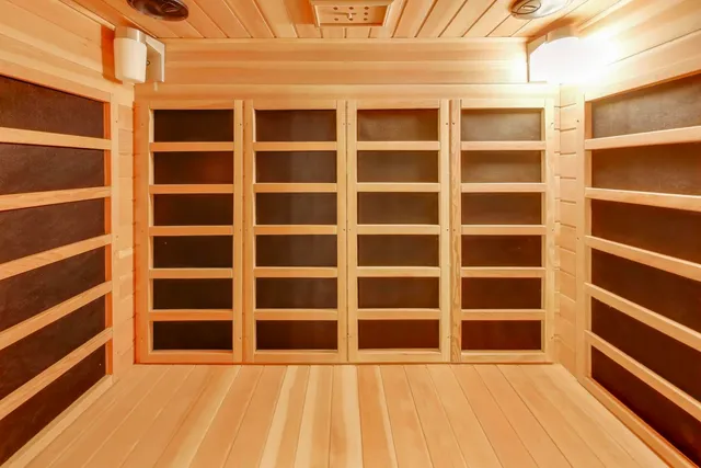a view of a patio with table and chairs potted plants and large tree