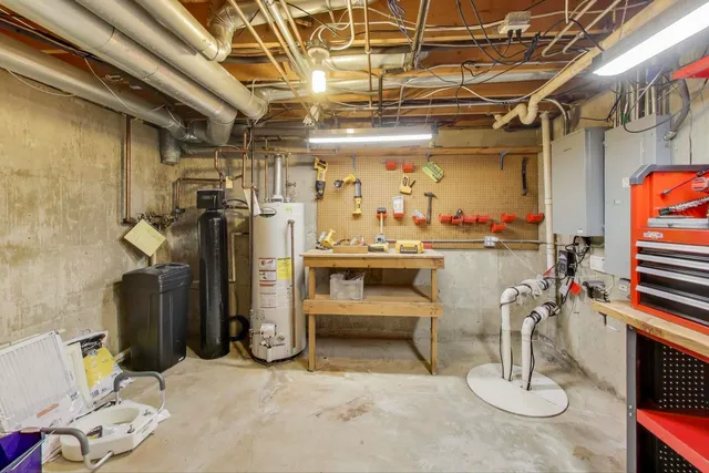 a view of house with backyard outdoor seating and green space