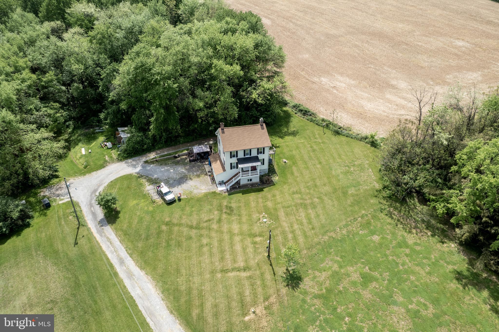 2995 Sams Creek Road New Windsor, MD 21776 - Photo 11 of 126 a view of a swimming pool with a patio