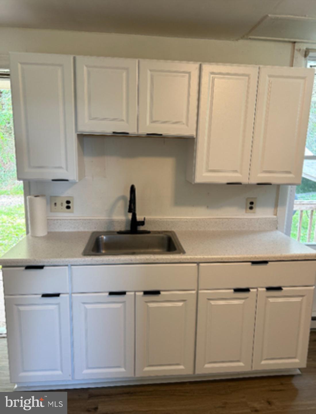 2995 Sams Creek Road New Windsor, MD 21776 - Photo 113 of 126 a kitchen with white cabinets and a sink