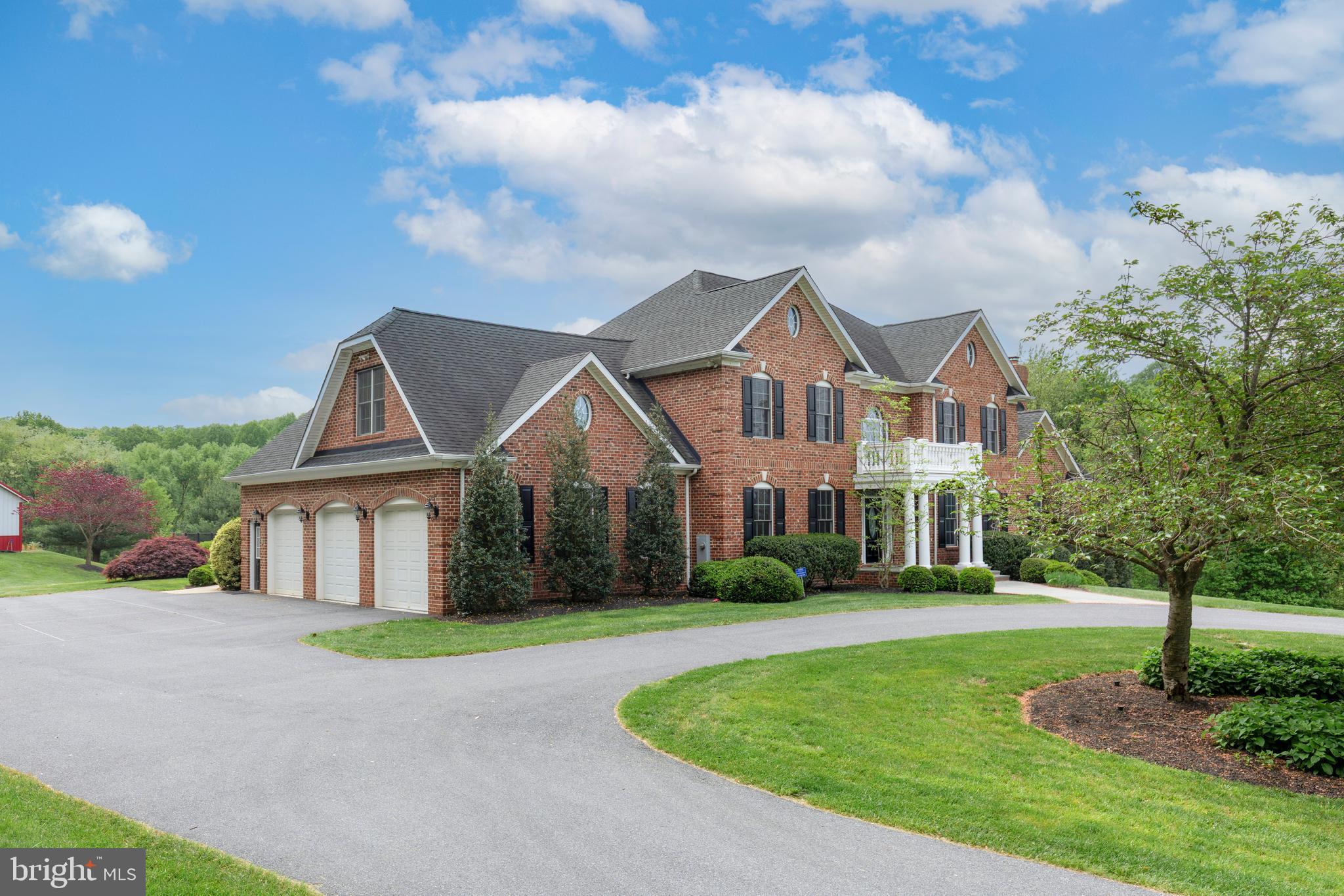 2995 Sams Creek Road New Windsor, MD 21776 - Photo 14 of 126 a front view of a house with a garden