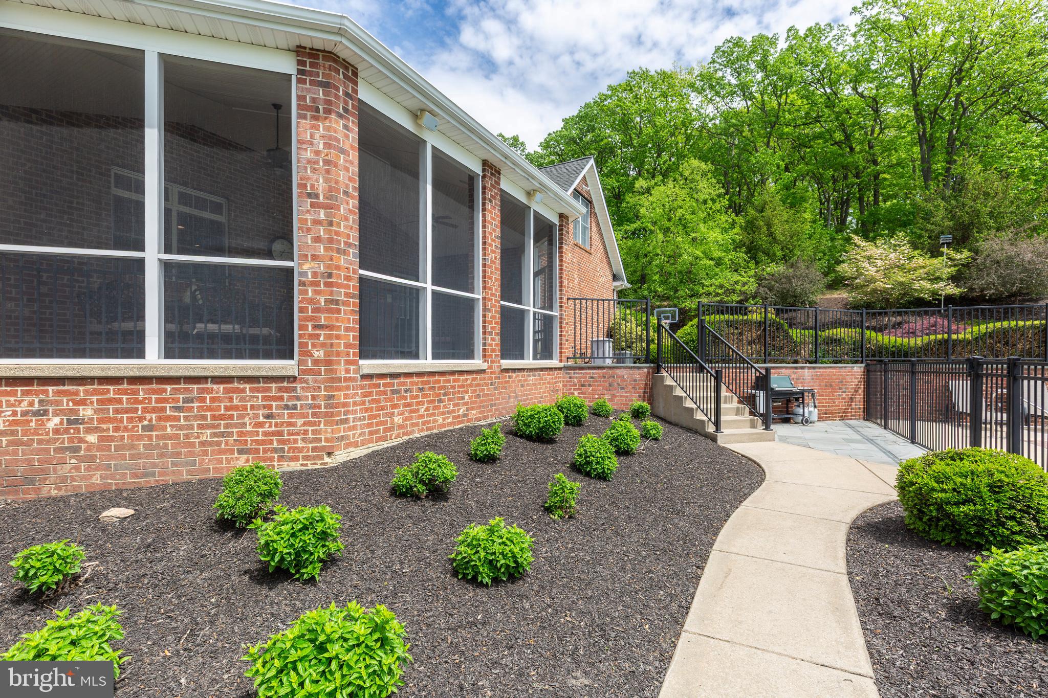 2995 Sams Creek Road New Windsor, MD 21776 - Photo 18 of 126 a view of a backyard with potted plants and large tree