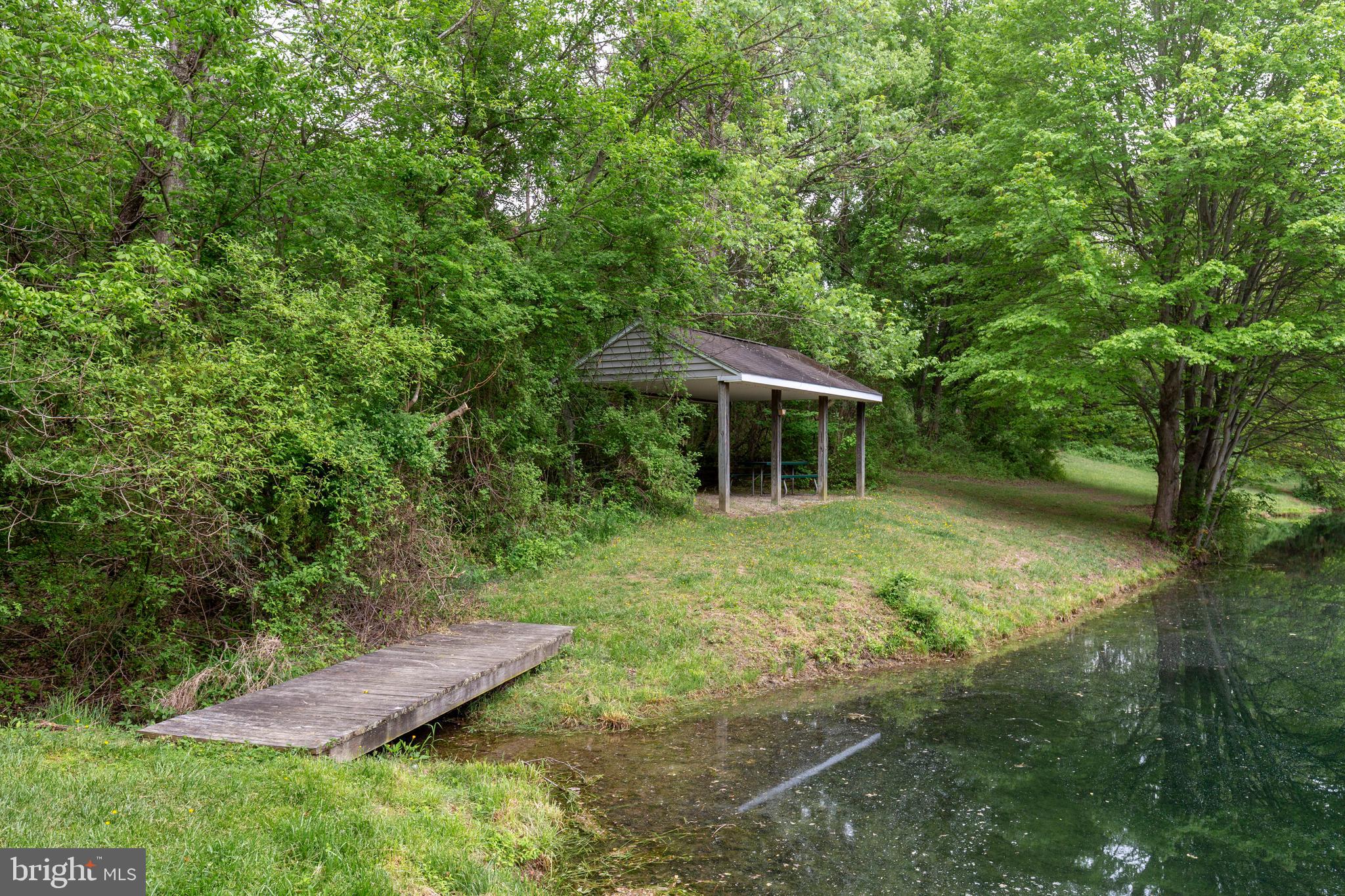 2995 Sams Creek Road New Windsor, MD 21776 - Photo 32 of 126 a backyard of a house with table and chairs