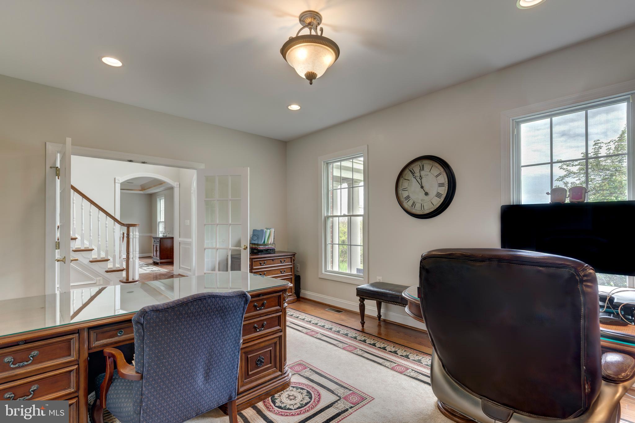 2995 Sams Creek Road New Windsor, MD 21776 - Photo 40 of 126 a living room with furniture a large window and a clock