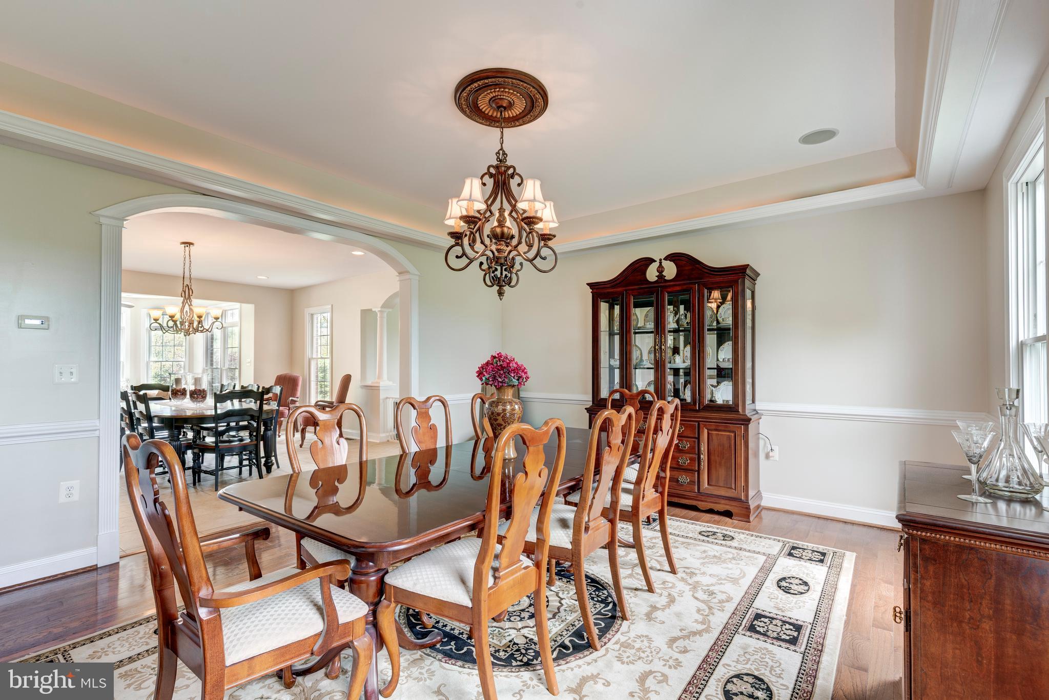 2995 Sams Creek Road New Windsor, MD 21776 - Photo 42 of 126 a view of a dining room with furniture and chandelier